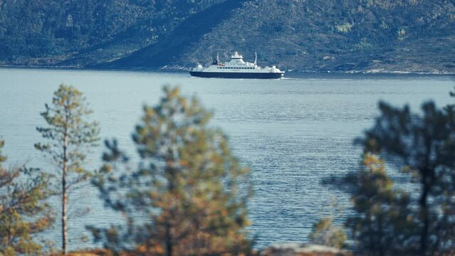 Bognes-Lodingen passenger ferry crosses the fjord.