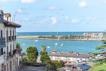 Panoramic view of the touristic village on the coast of Gipuzkoa Hondarribia and in the background Hendaye on a Sunny day