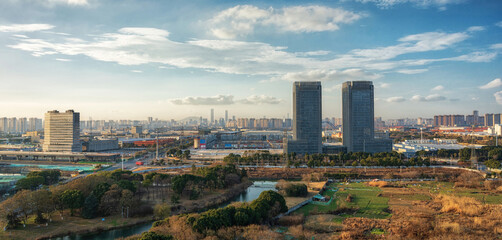 Cityscape of Wuxi with a River in the Foreground