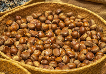 Whole Hazelnuts in Woven Basket Close-up