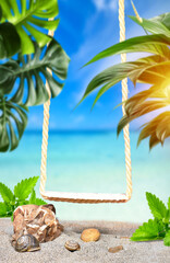 Wooden swing on a beach for putting your product. Relaxing, peaceful vacation scene at the beach