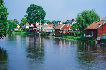 Buildings by a river during summer