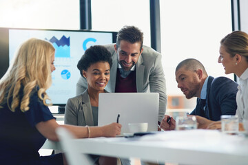 Laptop, boardroom and smile for man, meeting and reading of stock market for growth and sales. Group, employee and people with computer for finance, increase and investment of auditor in business