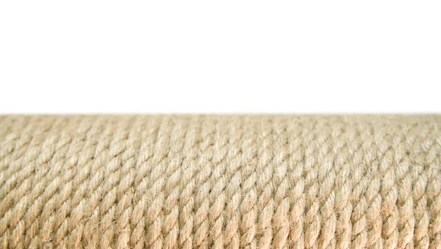 Jute rope in a skein close-up on a white background. Macro photography. Made from the Corchorus capsularis plant.