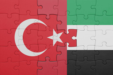 puzzle with the colourful national flag of united arab emirates and flag of turkey.