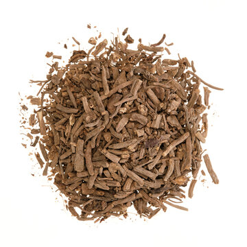Overhead view of dried valerian root (Valeriana officinalis, Radix valerianae), isolated on white background