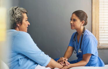 Holding hands, nurse and senior woman in bedroom with advice for healthcare, consulting or...