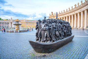 The Angels Unawares statue in Saint Peters Square, Vatican City. The bronze sculpture depicts a...