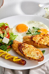 Hearty Combo Breakfast with Sunny-Side Up Eggs, Cheese Toasts, Sausage, and Fresh Vegetable Salad