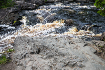 Fast stream water going over rocks. Waterfalls of Ruskeala