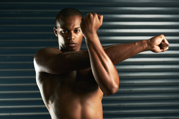 Obraz premium Arm, stretching and portrait of man with exercise for fitness, endurance and training in morning. Serious, athlete and male person with warm up for muscle, flexibility and preparation for workout