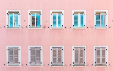 Fototapeta premium a pink building with windows