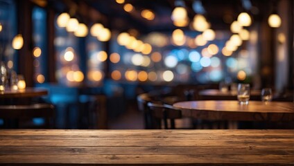 Empty wooden table top with lights bokeh on blur restaurant background.