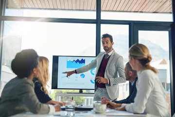 Charts, boardroom and stats for man, meeting and pointing of stock market for growth and sales....