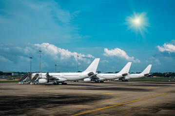 Three white passenger airplane in airport