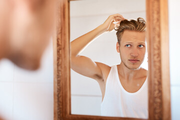 Hair care, salon and man with mirror in bathroom for maintenance, shampoo or morning routine....