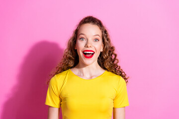 Photo of excited positive girl wear yellow top smiling empty space isolated pink color background