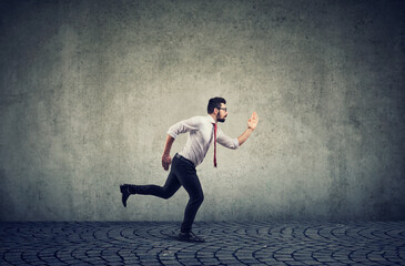 Full body side view of a young employee business man corporate lawyer running 