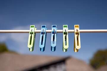clothespins on a clothesline against the background of a house