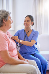 Obraz premium Nurse, woman and stethoscope or senior care, nursing and caregiver with patient for healthcare in living room. Check up, appointment and listen for chest problem, medical employee and wellness help