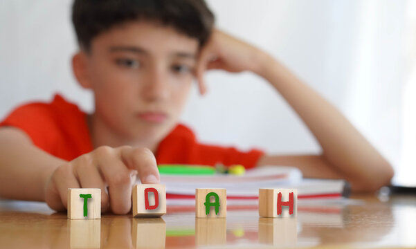 child with attention deficit disorder frustrated doing homework, importance of educational needs and special attention to this problem.