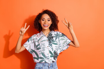 Photo of excited friendly girl make v sign isolated bright color background