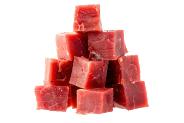 Raw beef meat cubes scattered across a white surface, like dice on a game board, isolated on white background