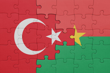puzzle with the colourful national flag of burkina faso and flag of turkey.