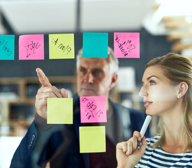 Thinking, hand pointing or business woman with mature mentor planning in office for calendar,...