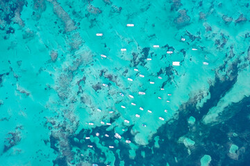 Many yachts and sailboats in sea from bird's eye view. Drone photo blue sea with yachts. Dominicana.