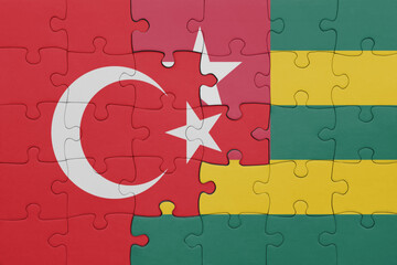 puzzle with the colourful national flag of togo and flag of turkey.