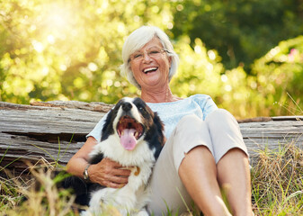 Senior woman, portrait and dog in woods to relax with smile, care or adventure in summer sunshine....