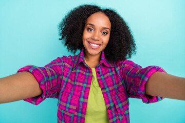 Photo of pretty young woman make selfie wear checkered shirt isolated on teal color background