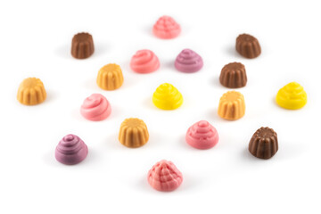 Set of delicious jelly candies in shape of meringue and cupcake on white background