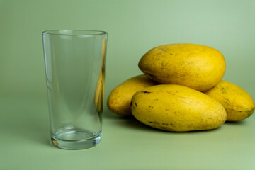 Ripe Mango Juice with Green Background