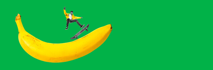 Energy and dynamics. Young guy in motion on skateboard riding on banana against green background....