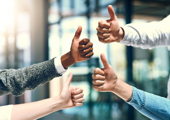 Hands, team and thumbs up with business people closeup in glass office for promotion, solidarity or...