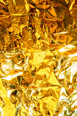 The background of crushed gold shines golden