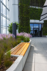 Bench with garden in a glass atrium
