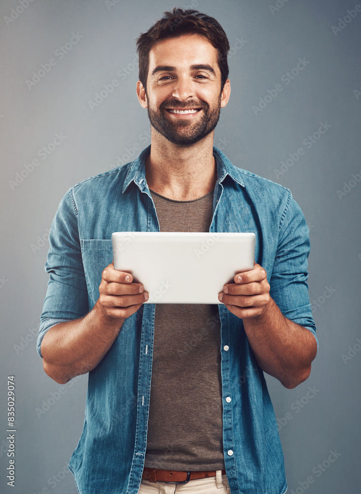 Poster man, studio and portrait with tablet and smile, career with software programming in london. male cre