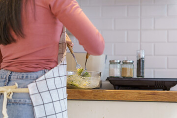 Asian woman preparing vegetable salad in the kitchen Healthy Food Healthy Cooking dieting Weight loss  homemade salad healthy