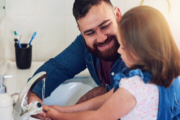 Father, girl and wash hands with health for family hygiene in bathroom home, bonding and fun...