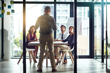 Fototapeta premium Proposal, presentation and business people in office with man for planning, strategy and ideas. Advice, meeting and team in conference room together for discussion on growth, development or support