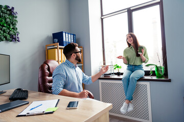 Photo of smiling cheerful coworkers wear shirts drinking coffee having break indoors workplace...