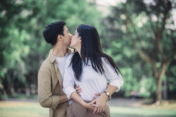 Fototapeta premium Lesbian couple sharing romantic love and care in public, celebrating joyful union as life partners.