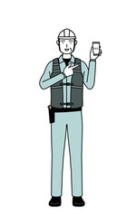 Senior male engineer in helmet and work wear recommending cashless online payments on a smartphone.