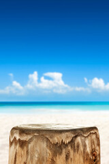 Wooden pedestal of empty space for your decoration and hot summer day. Landscape of sea and beach 