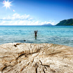 Wooden pedestal of empty space for your decoration and hot summer day. Landscape of sea and beach 