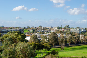 A elevated view of suburban skyline with residential houses and apartment buildings in Maribyrnong, a Melbourne’s suburb, Australia. Background texture of Australian neighbourhood with modern homes.