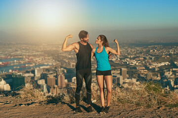 Couple, muscle and flex outdoor for fitness on mountain with city background of New York, workout...